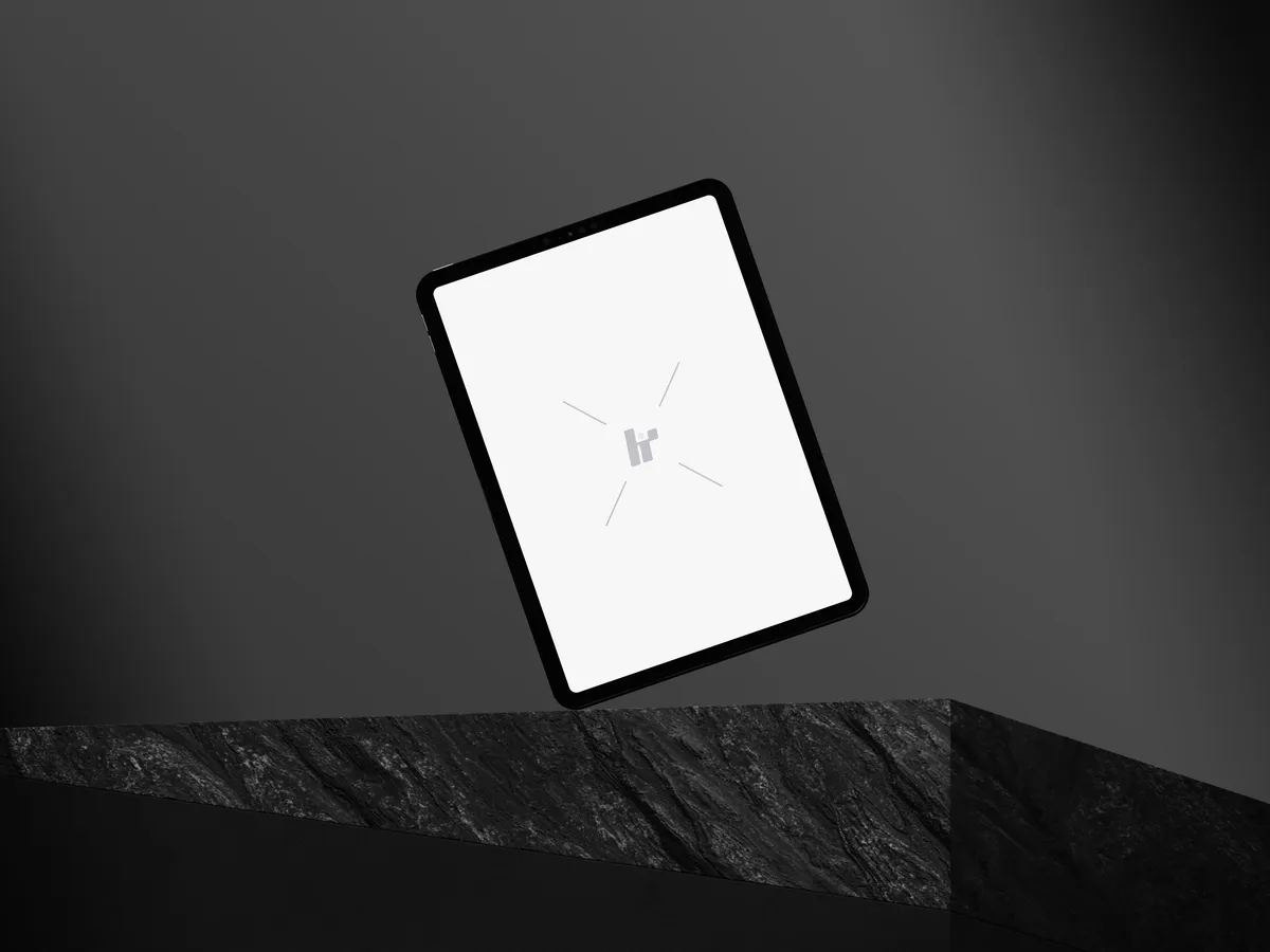 iPad Pro floating left on a rock cube.