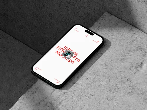 iPhone Pro on concrete surface, viewed from top right angle