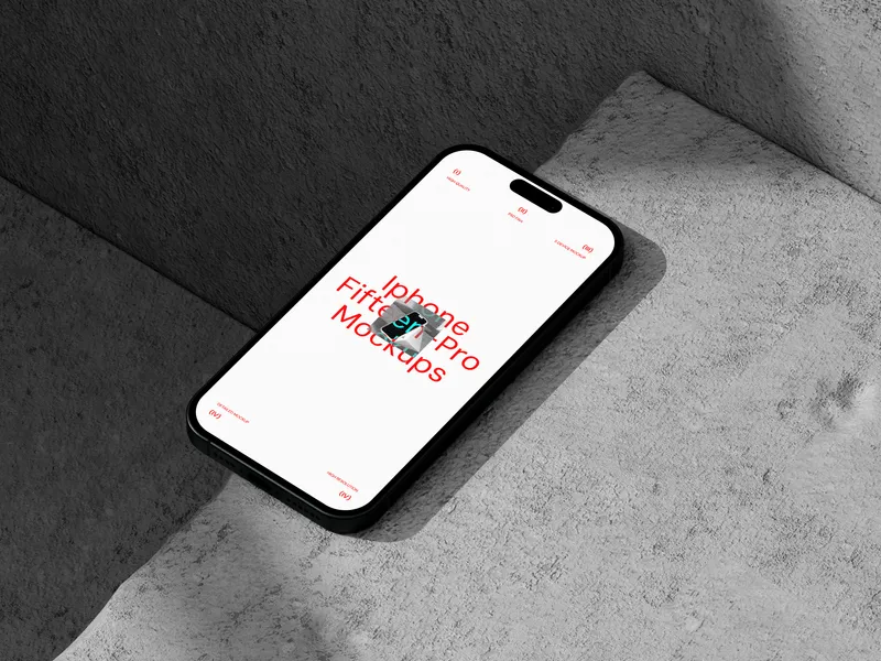 iPhone Pro on concrete surface, viewed from top right angle