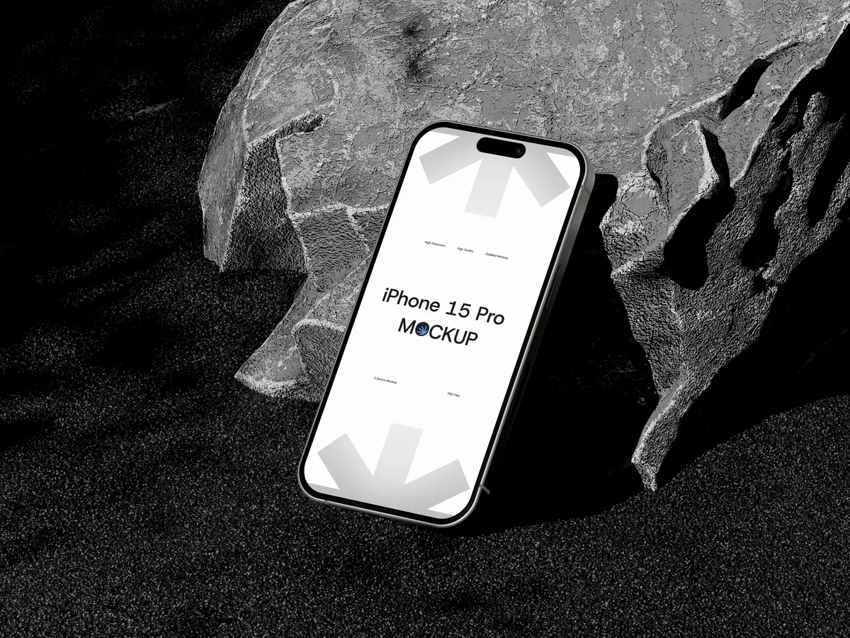 iPhone Pro on rock formation, screen visible, top-right angle view
