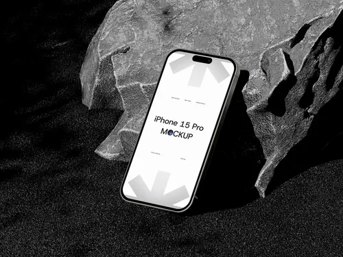 iPhone Pro on rock formation, screen visible, top-right angle view