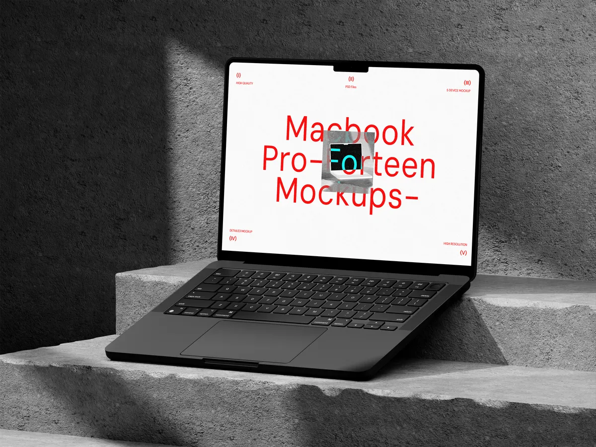 MacBook Pro on concrete, viewed from front right angle.