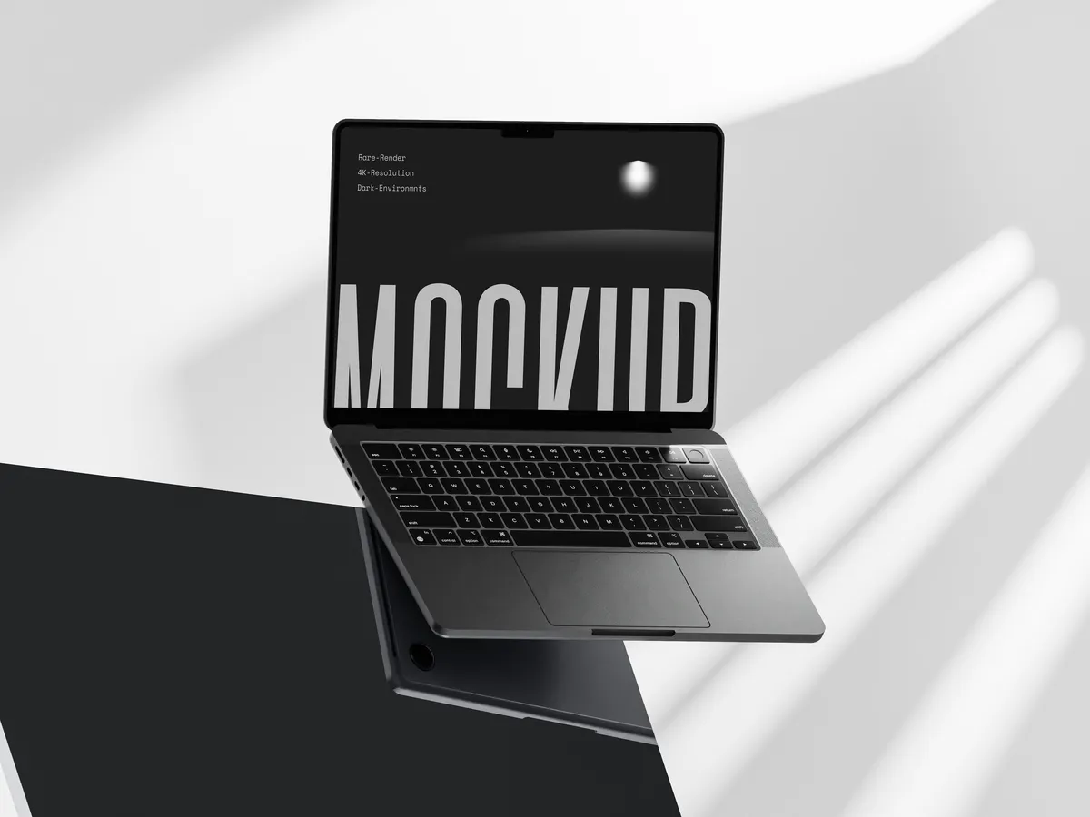 MacBook Pro on dark glass surface, floating at an angle, front view.
