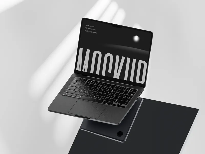 MacBook Pro on dark glass with floating title overlay