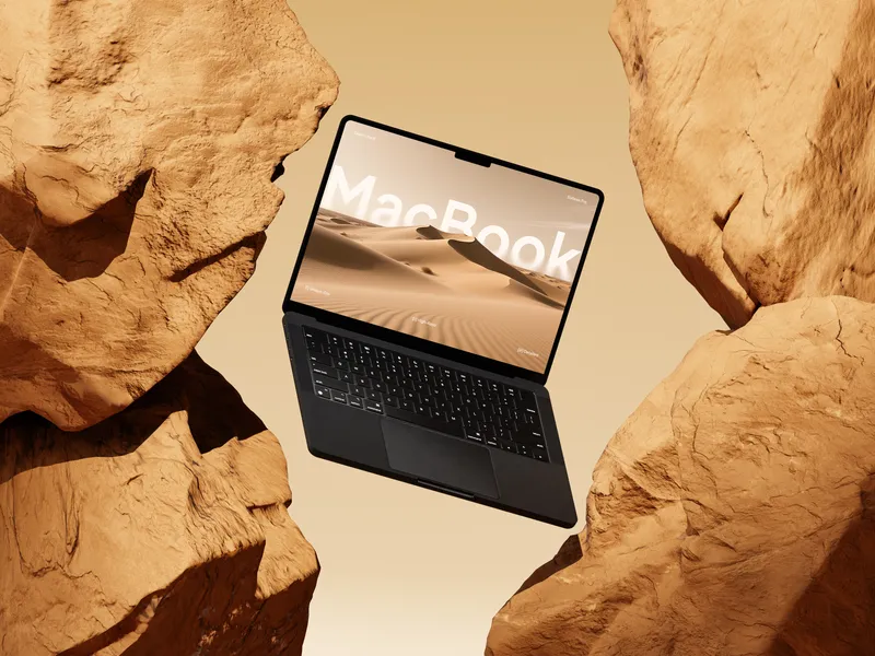 Yellow MacBook Pro on rock, floating at an angle