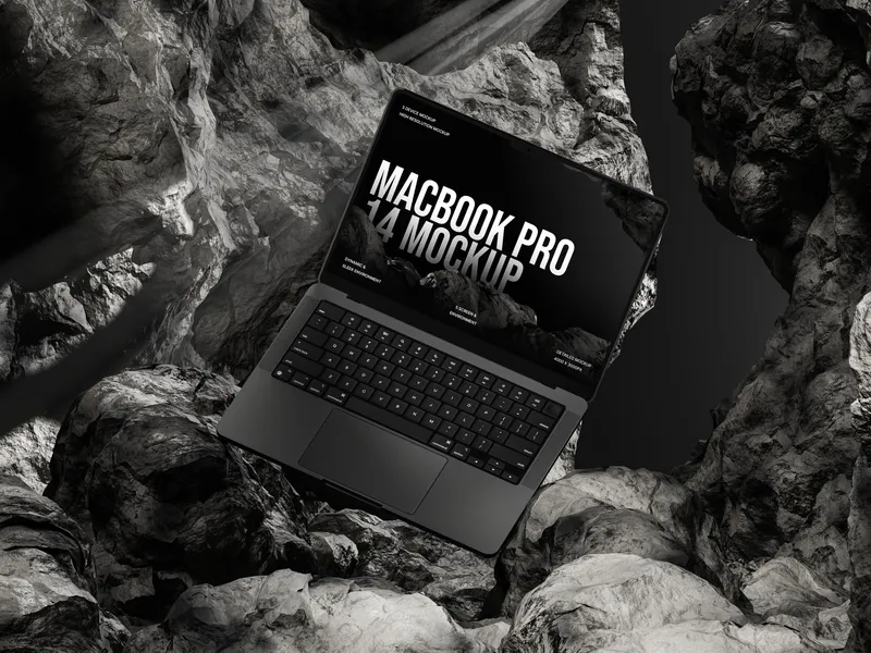 MacBook Pro on rocky cave floor, tilted at an angle